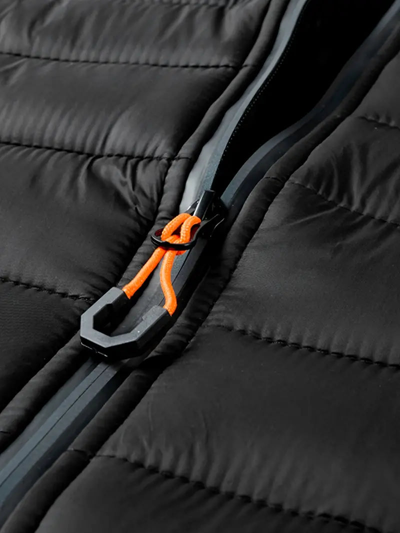 Women's black puffer jacket with hood, a chic and warm essential for the winter season.