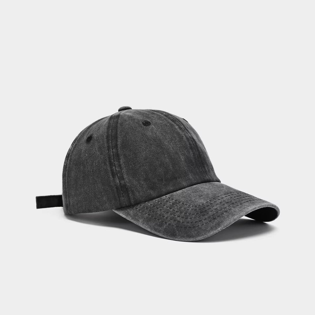 Adjustable women's washed cotton baseball cap, comfortable fit, vintage look, great for sun protection.