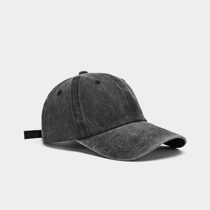 Adjustable women's washed cotton baseball cap, comfortable fit, vintage look, great for sun protection.