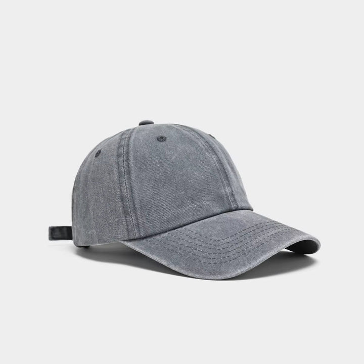 Model showcasing an adjustable washed cotton baseball cap, women's casual accessory, perfect for walks.