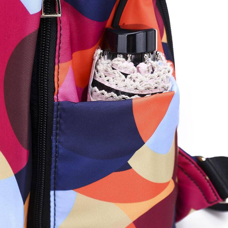 Back view of water-resistant women's travel backpack with anti-theft features, ergonomic design