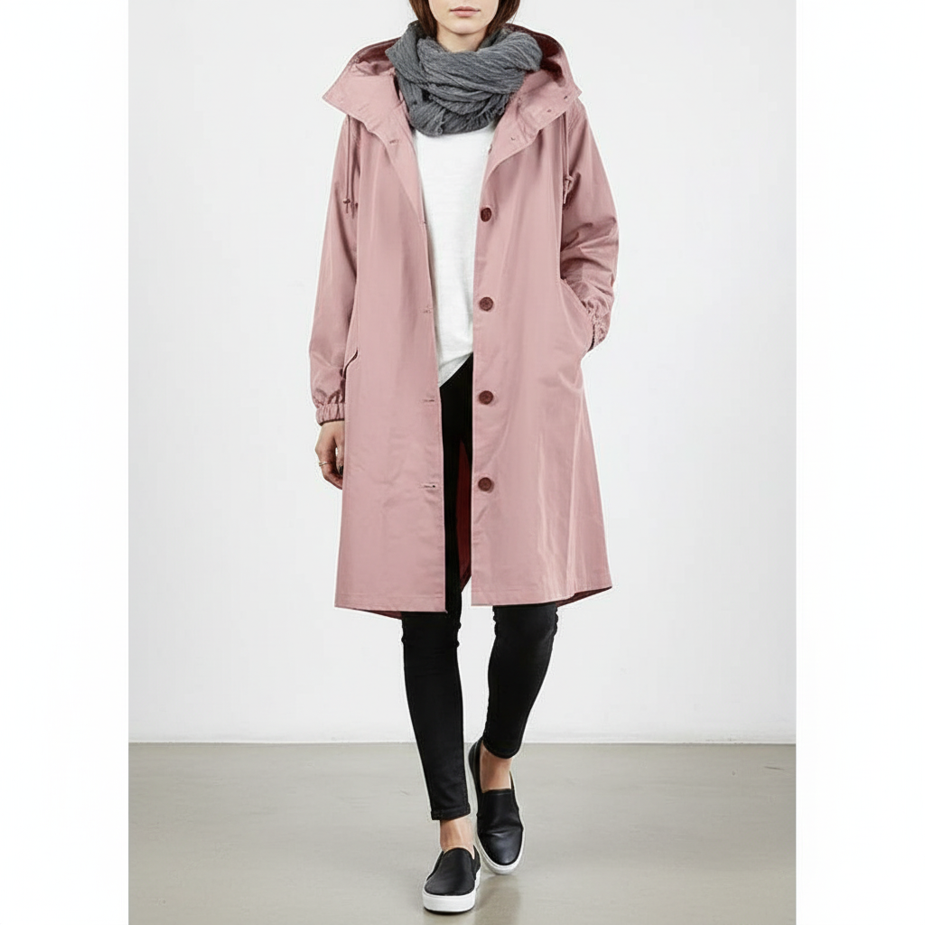 Stylish women's longline hooded raincoat, perfect for travel & casual spring/fall wear.