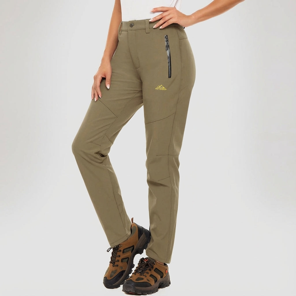 Stylish women's black waterproof outdoor trousers with fleece lining, perfect for winter adventures