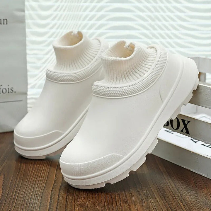 Women's everyday slip-on clogs with a warm knit ankle cuff and waterproof design for versatility.