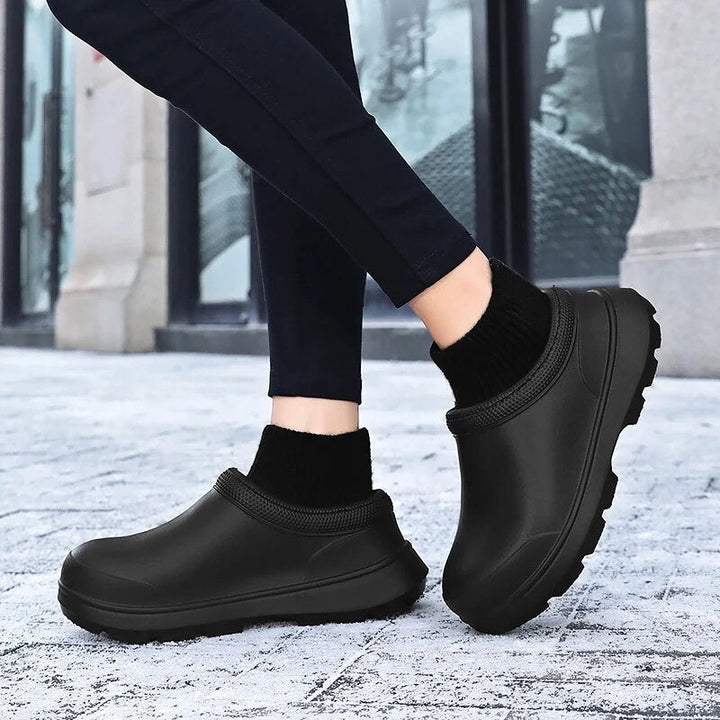 Women's Madeline waterproof clogs with knit cuff on a foot, showcasing comfortable, casual style.