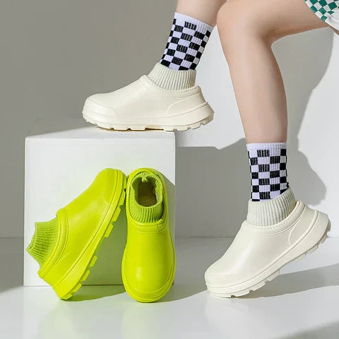 Back view of women's slip-on waterproof clogs with supportive knit ankle cuff for all-day comfort.