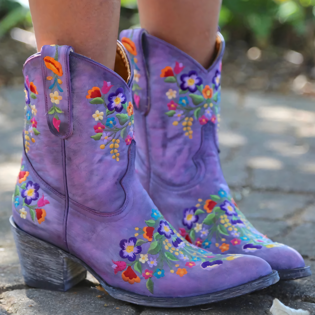 Festival-ready waterproof cowgirl boots for women, featuring a stylish vintage look & rugged build.