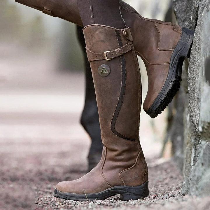 Women's waterproof winter boots, warm & cozy for snow. Durable outdoor footwear with superior grip.