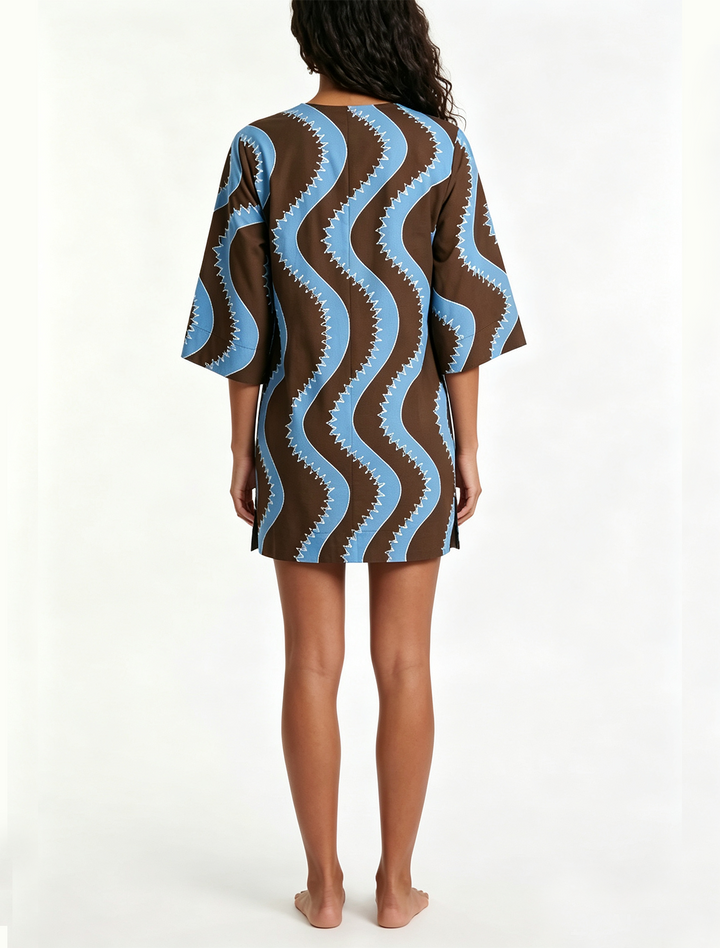 Stylish women's wave print mini shift dress, featuring elbow sleeves & a button front. A chic summer or vacation piece.