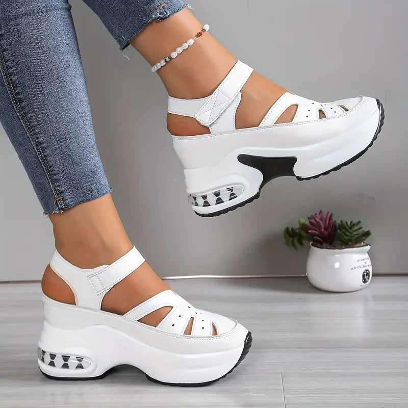 Cushioned women's walking sandals, wedge platform style with breathable cutouts & adjustable strap for comfort.
