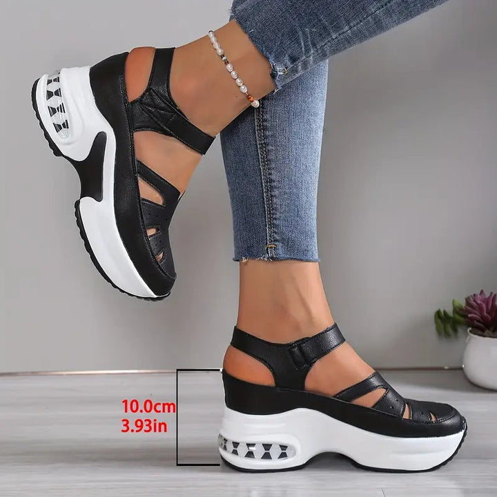 Summer-ready women's wedge sandals with breathable cutouts, a cushioned platform, great for casual elegance.