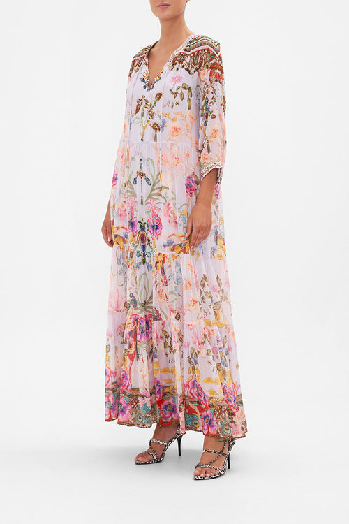 Women's white Bohemian floral maxi dress, perfect for summer vacation. Flowy and elegant resort wear style.