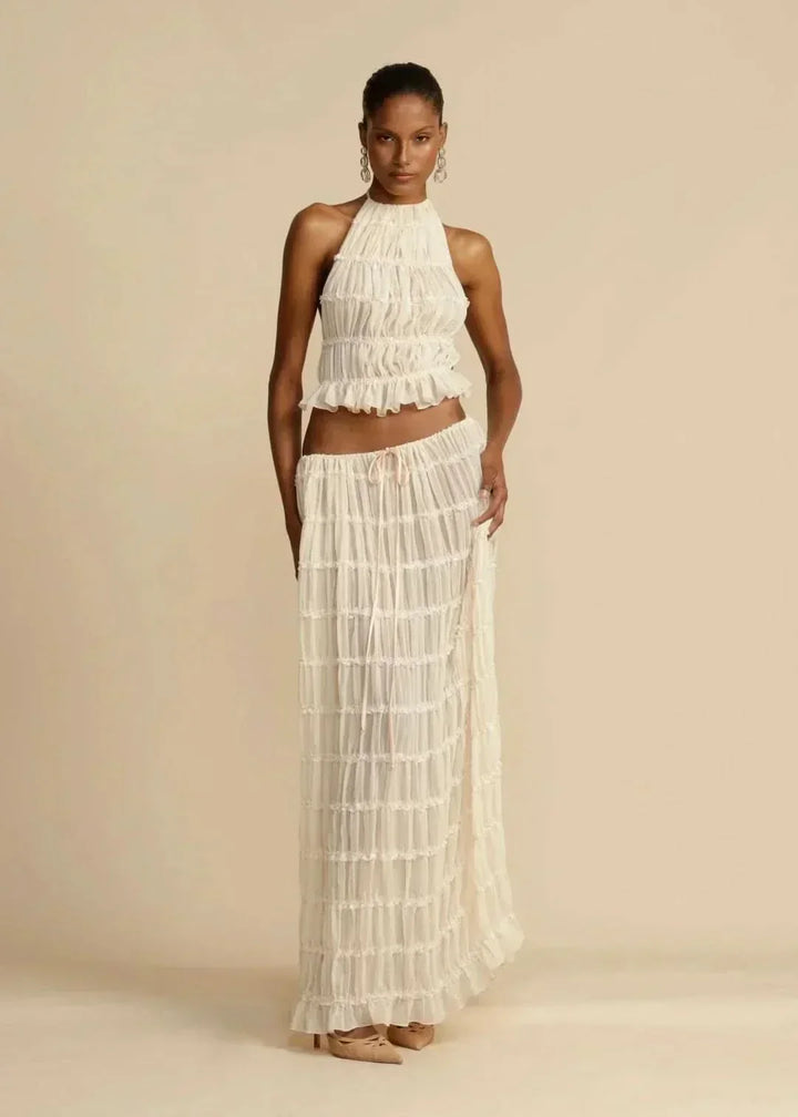 Women's white boho off-shoulder crop top and matching maxi skirt set, perfect for summer beachwear