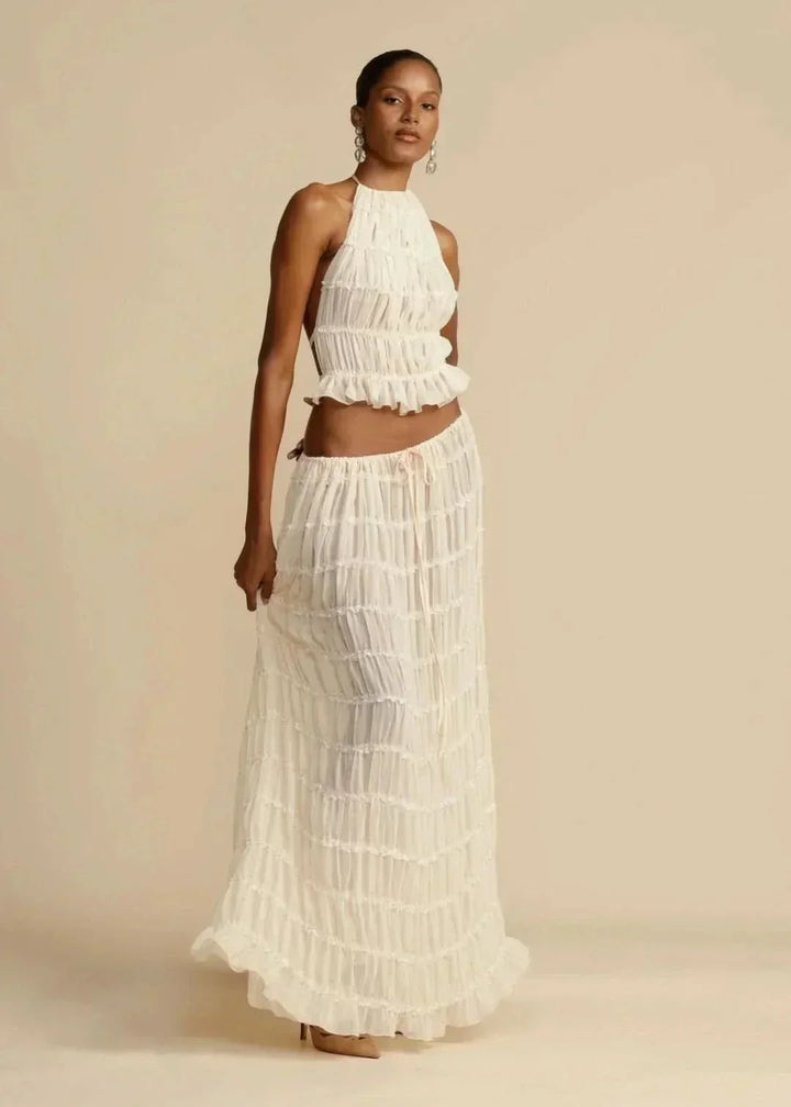 Stylish two-piece white summer outfit for women: off-shoulder crop top and long boho maxi skirt
