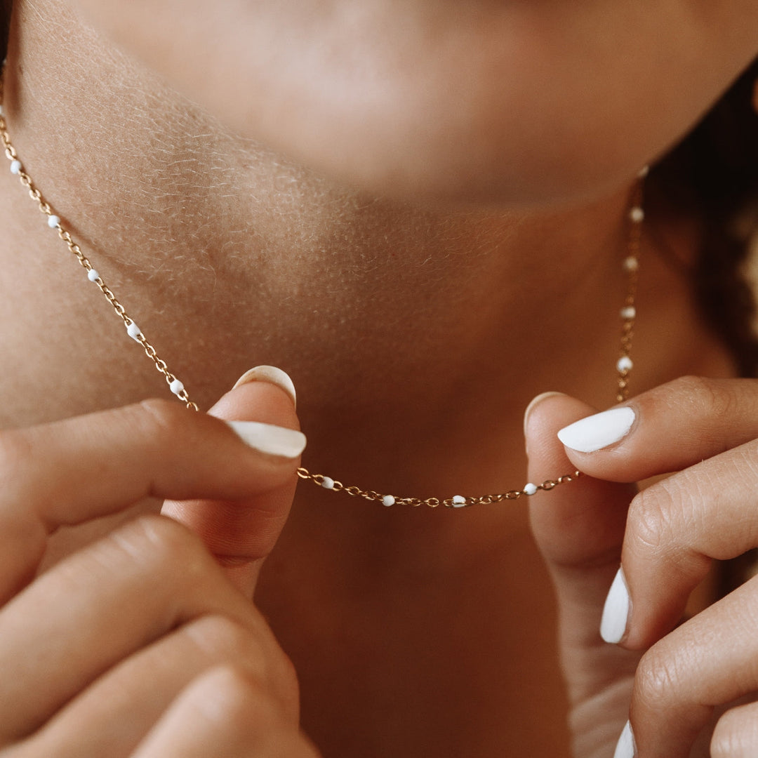 Aurielle white enamel bead necklace. Stylish choker for modern women's fashion.