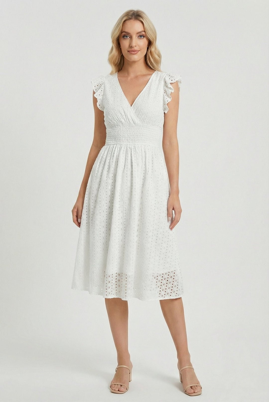 Women's white eyelet midi dress with ruffled sleeves, perfect for summer casual wear.