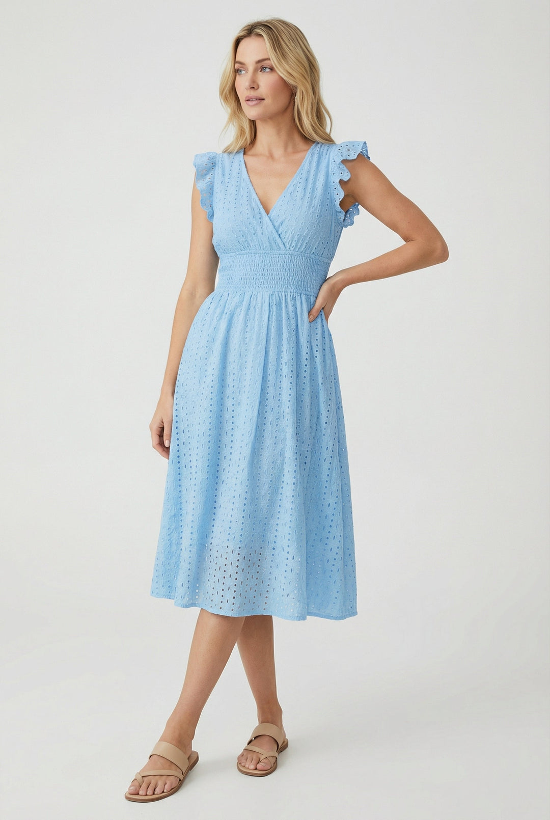 Charming women's eyelet midi dress with delicate ruffled sleeves & smocked waist detail.