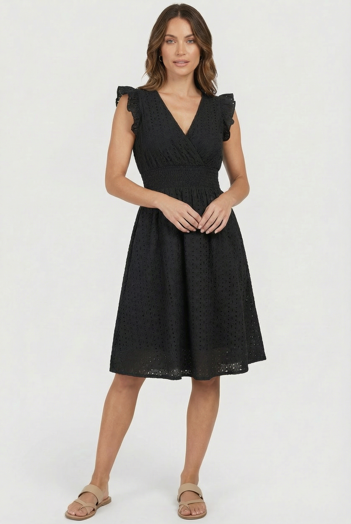 Elegant white eyelet midi dress, women's flared summer style with chic ruffled sleeves.