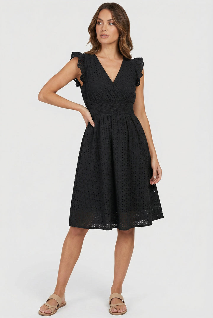 Flowy eyelet midi dress, women's warm weather fashion with smocked waist & ruffles.