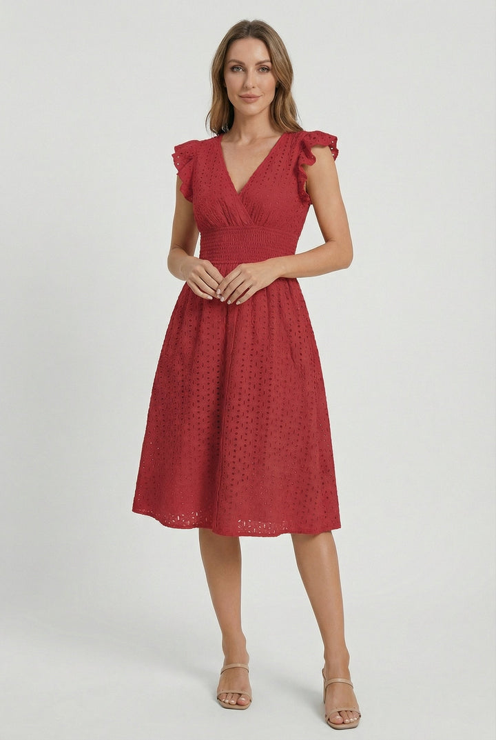 Boho-chic women's eyelet dress, midi length, with romantic ruffled sleeves and smocked detail.