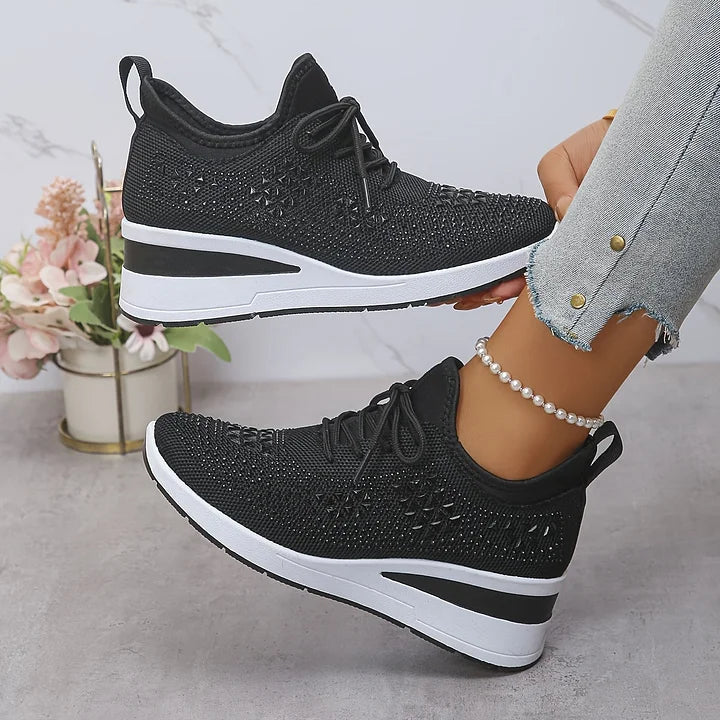 Elegant women's black walking shoes with superior arch support & sparkling details for style.