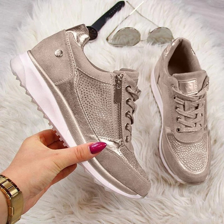Woman wearing white Gabriele orthopedic sneakers, demonstrating comfortable casual shoes