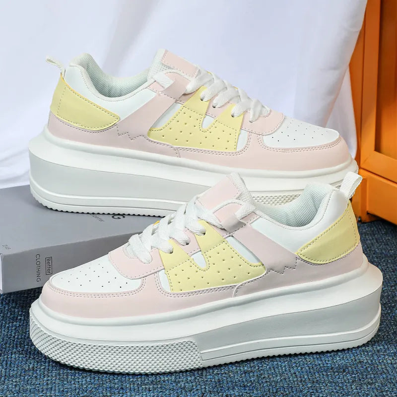 Trendy women's platform sneakers with perforated details & lace-up closure for comfortable everyday wear.