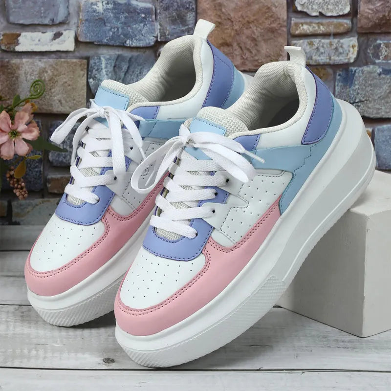 Stylish perforated white women's platform lace-up sneakers, perfect for spring casual outfits.