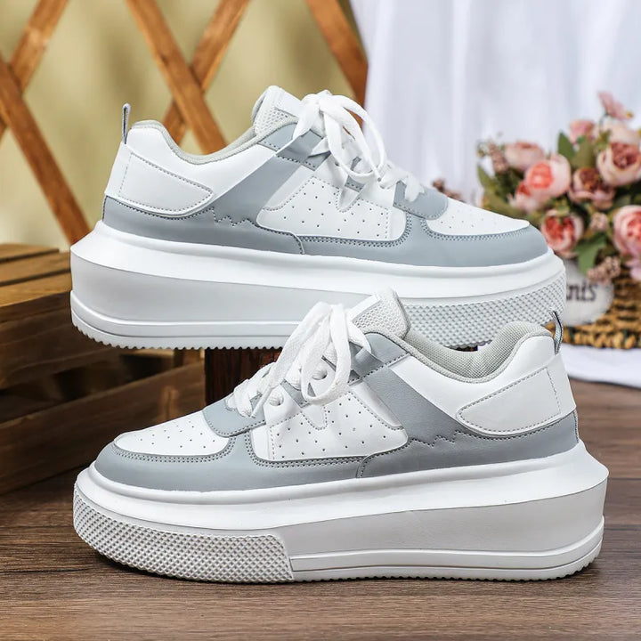 Fashionable women's platform lace-up sneakers with perforated design, a must-have for trendy casual looks.