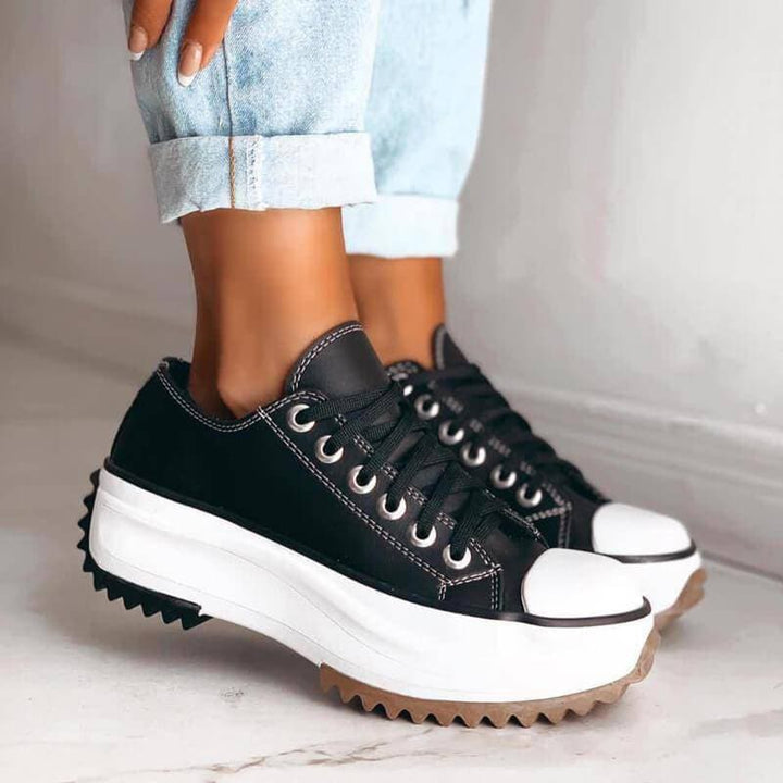 Comfortable women's platform sneakers, featuring a chic design and durable lace-up closure for casual wear.