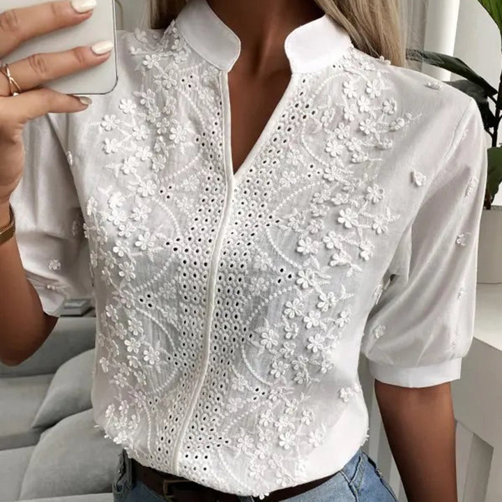 Trendy women's white relaxed blouse, Serena. Chic comfortable top for versatile spring and summer outfits.
