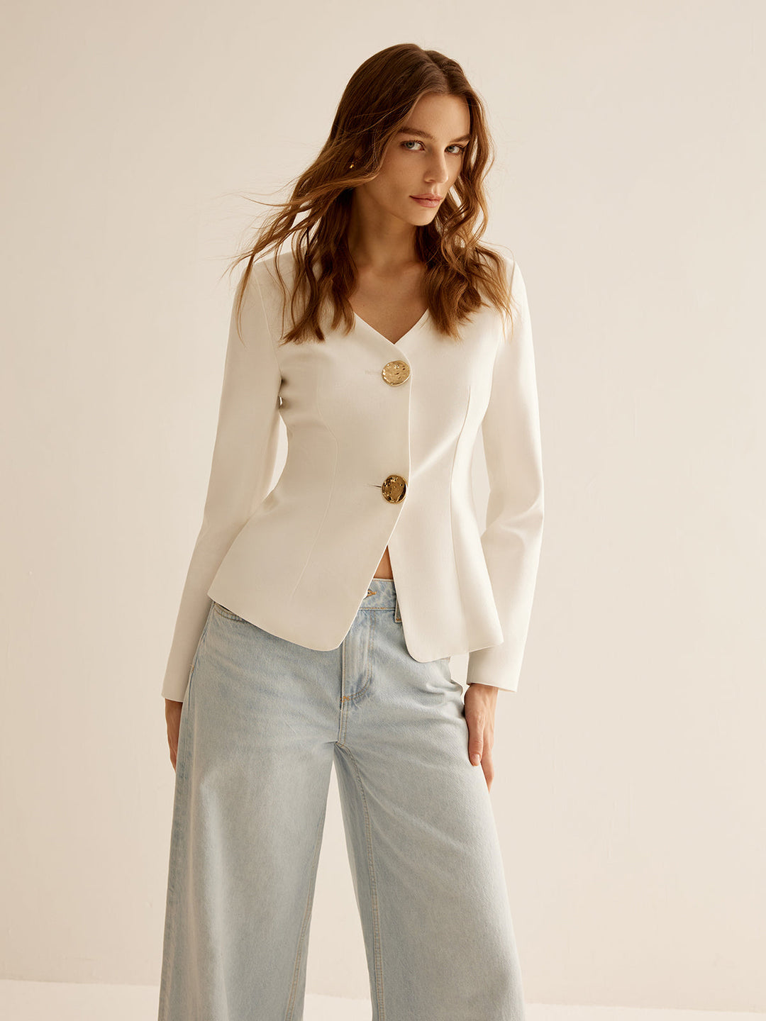 Chic white slim fit women's blazer, a versatile piece for professional work attire, office fashion, or formal events.