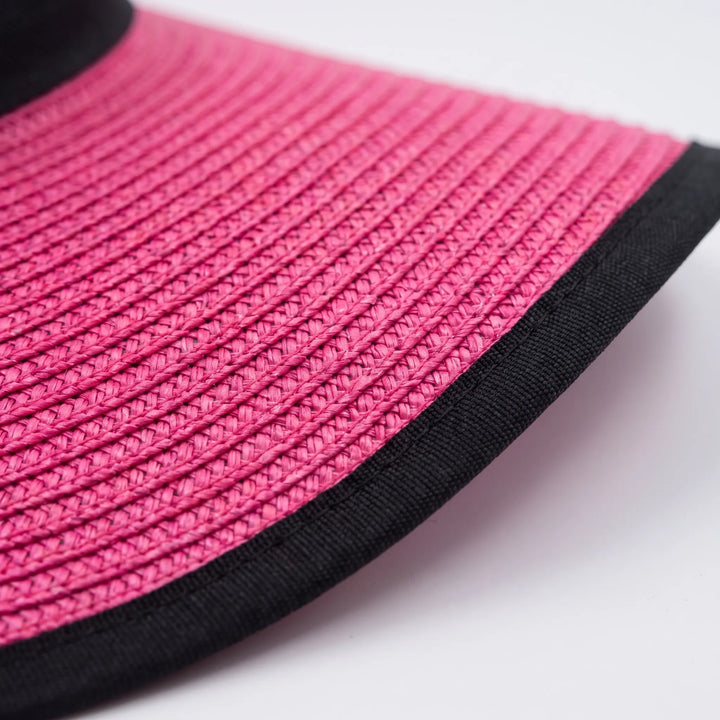 Packable wide brim floppy sun hat for women, ideal for summer vacation & beach trips. Essential travel accessory.