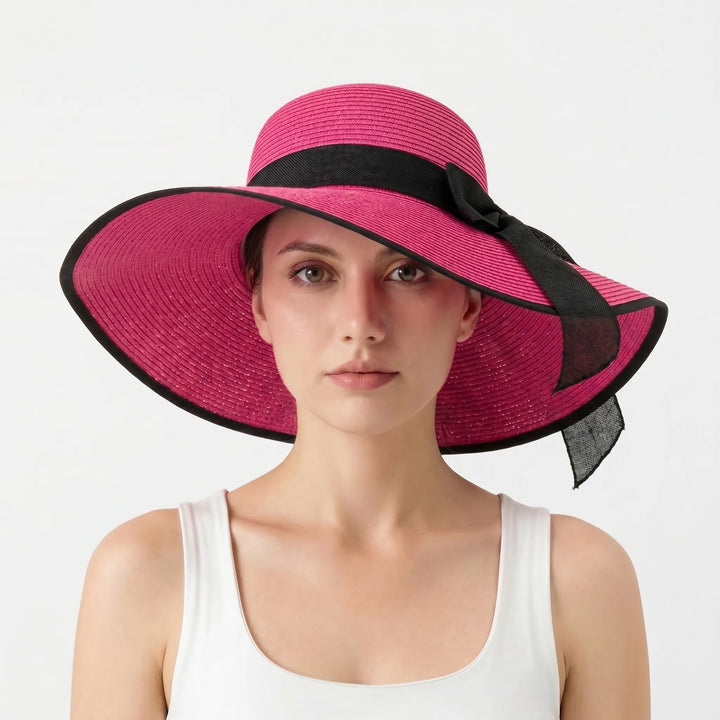 Elegant women's floppy wide brim hat, designed for summer beach days & stylish travel. Sun protection.