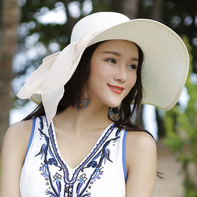 Stylish wide brim straw sun hat for women, 'Candy' design, ideal for sun protection and fashion