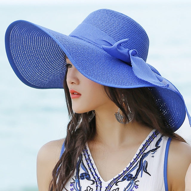 Candy-colored wide brim straw hat for women, sun protection, beach fashion, and outdoor style