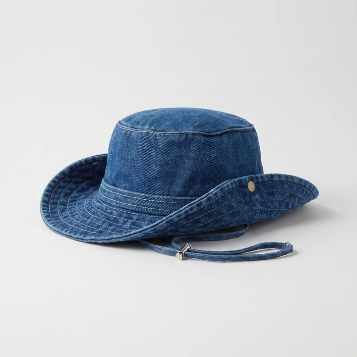 Lightweight women's wide brim sun bucket hat. Breathable summer accessory, essential for travel, beachwear, and outdoor sun protection.