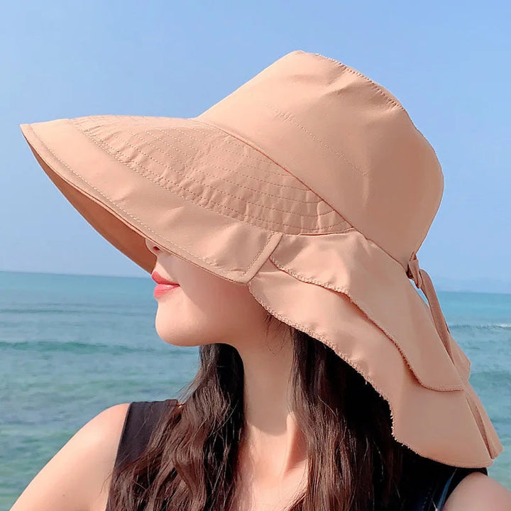 Women's wide brim sun hat for ultimate UV protection, perfect for beach, summer travel, gardening, and outdoor activities.