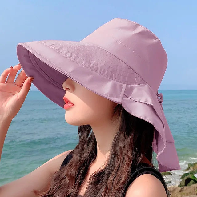Breathable women's wide brim UV protection sun hat, adjustable for comfort, ideal for summer, beach, and gardening.