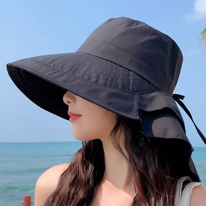 Versatile women's wide brim sun hat, UV protective and foldable, essential for summer, beach trips, and outdoor activities.