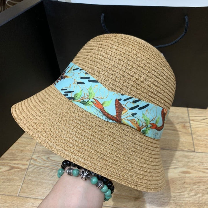 Fashionable women's beach hat, wide brim with bow detail, essential for holidays.