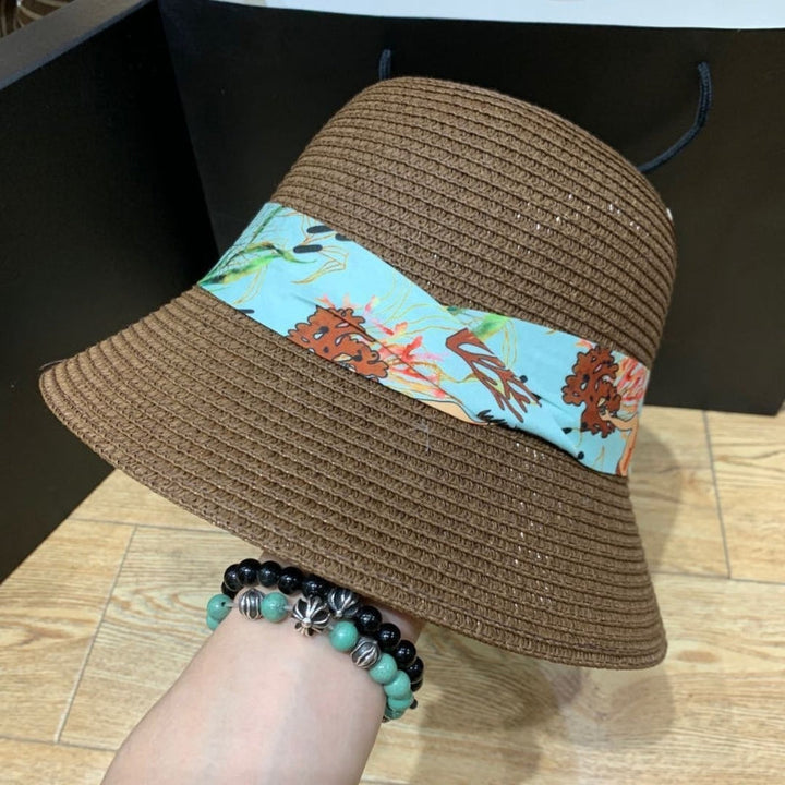 Breathable wide-brimmed sun hat with a decorative bow for women's summer style.