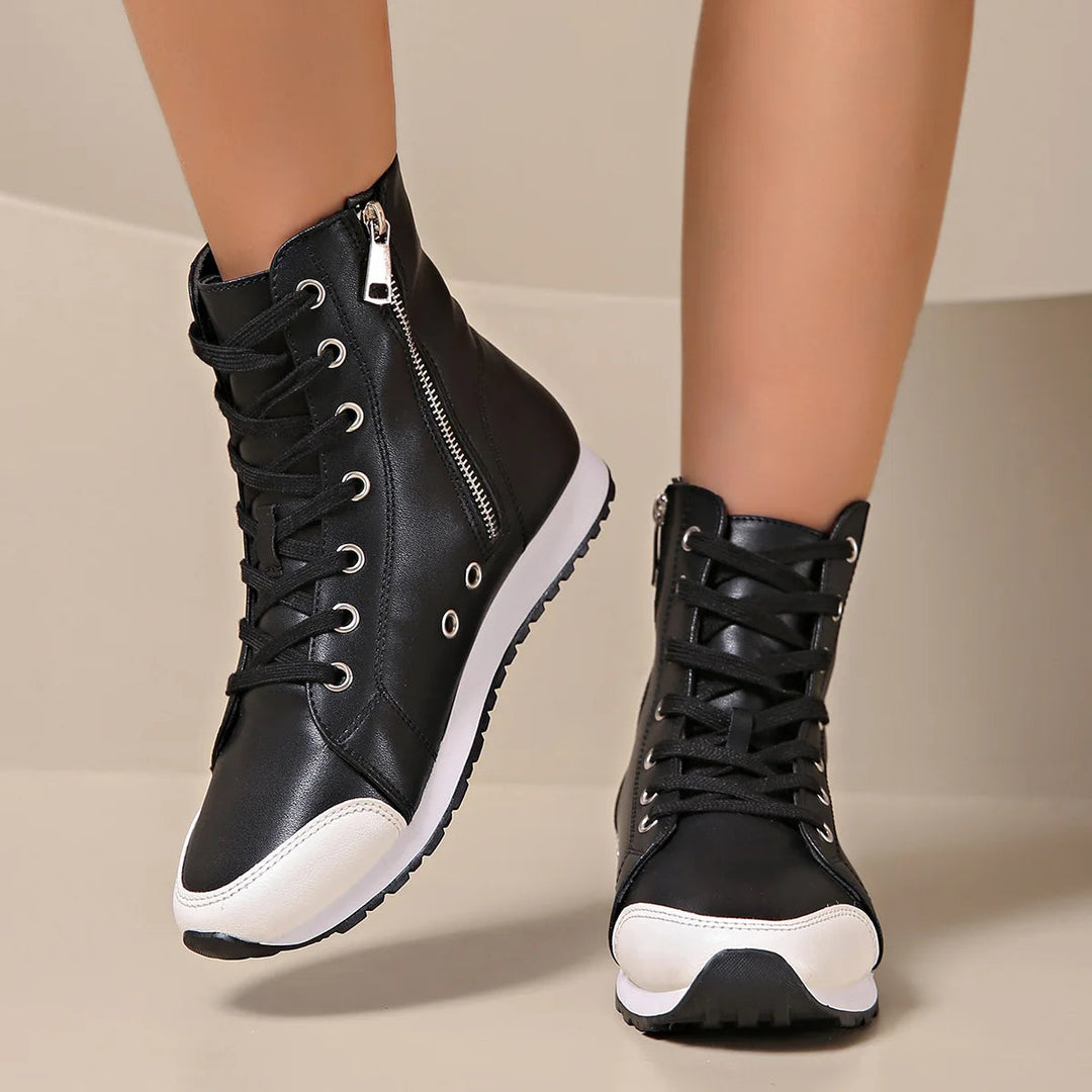 Stylish black & white women's wide fit orthopedic lace-up sneakers, ideal for daily comfort & support.