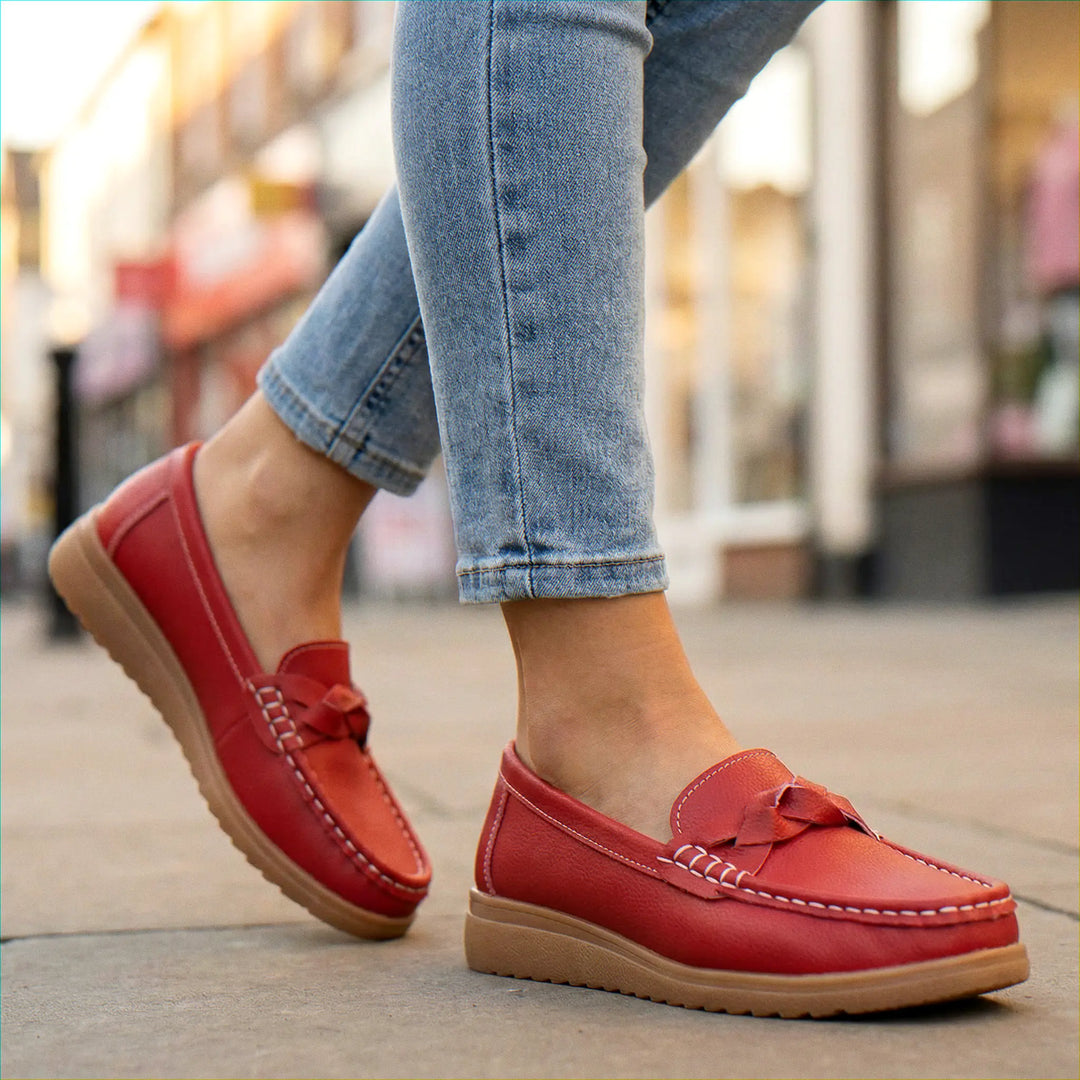 Women's wide fit orthopedic slip-on loafers, combining style with arch support.