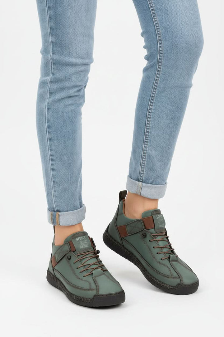 Woman in motion, wearing flexible wide-fit walking shoes. Cushioned for all-day comfort during active travel.