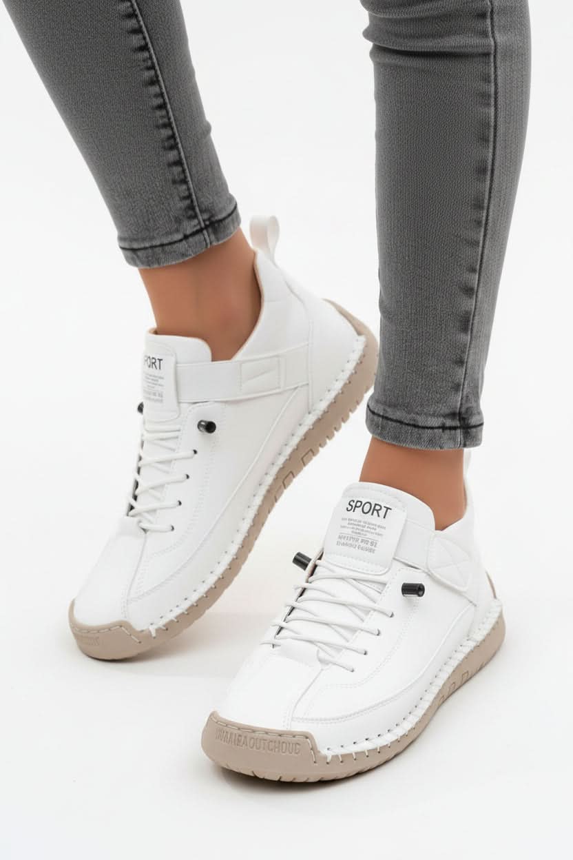 Pair of women's cushioned walking shoes in a wide fit. Lightweight & flexible for all-day comfort and active use.