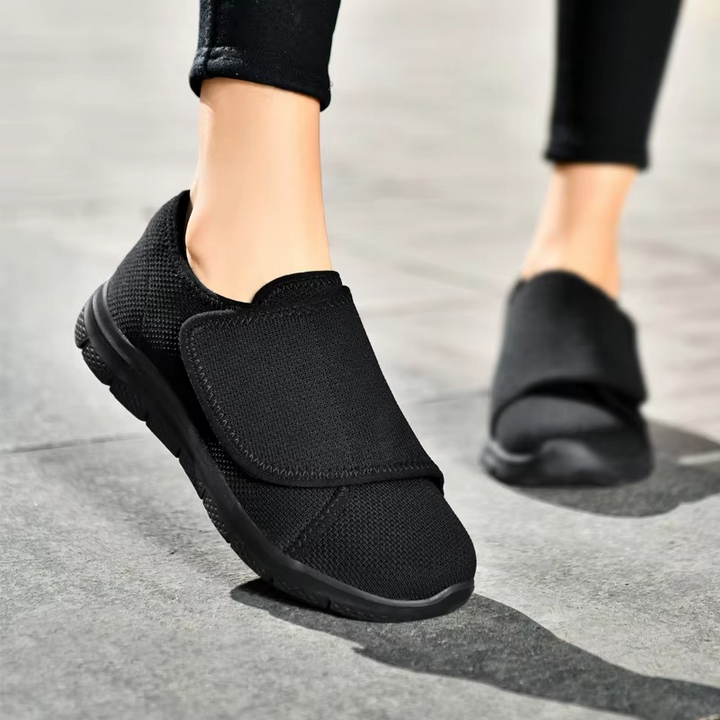 Women's wide fit walking shoes, cushioned for daily wear, featuring adjustable straps.