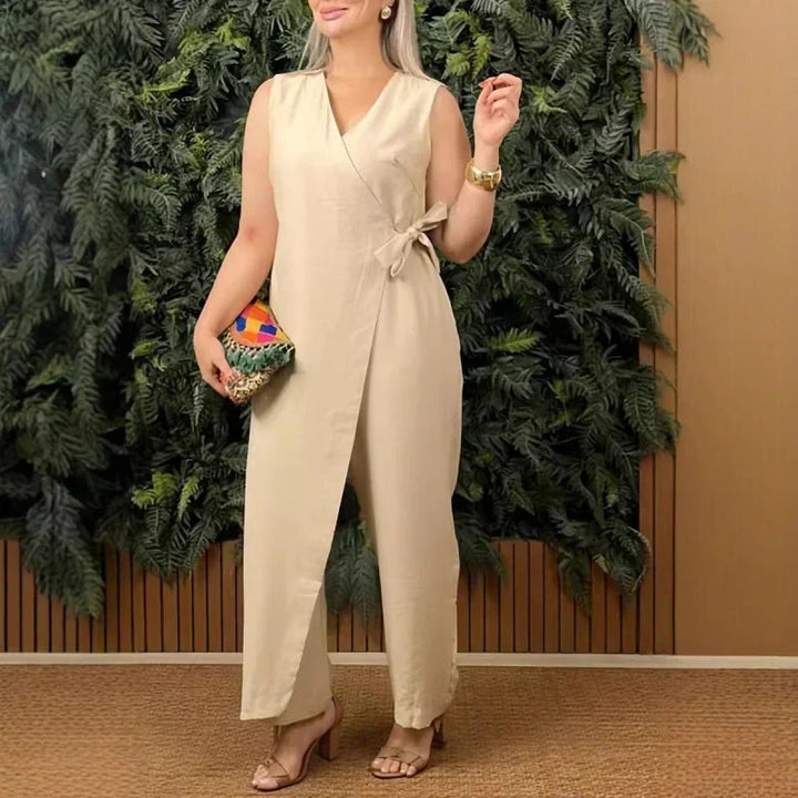 Comfortable women's sleeveless wide-leg jumpsuit, featuring a flattering wrap V-neck and adjustable tie waist.