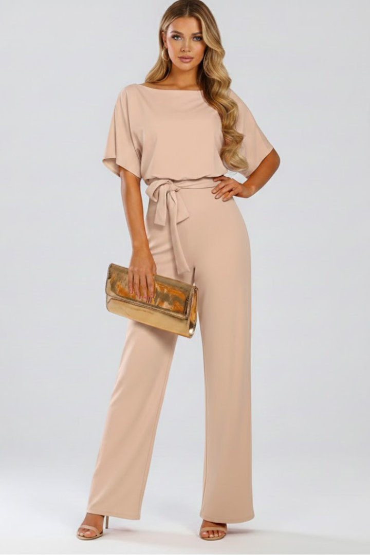 Stylish women's wide leg short sleeve jumpsuit featuring a cinched waist belt, ideal for spring fashion.
