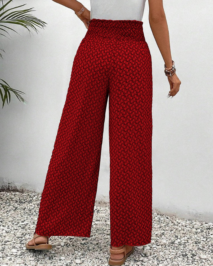 Chic women's patterned wide leg trousers, relaxed fit, with a striking geometric design.
